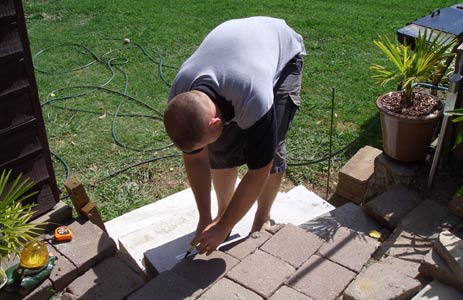 Measuring to trim and reset pavers